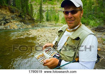 Stock Photo - Fly fisherman. Fotosearch