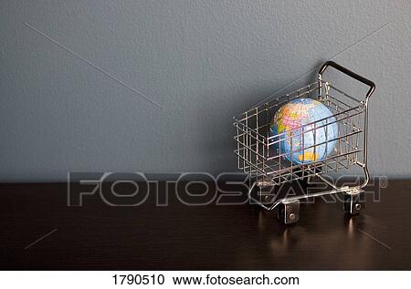 Globe in shopping cart View Large Photo Image Stock Image - Globe in shopping cart. Fotosearch