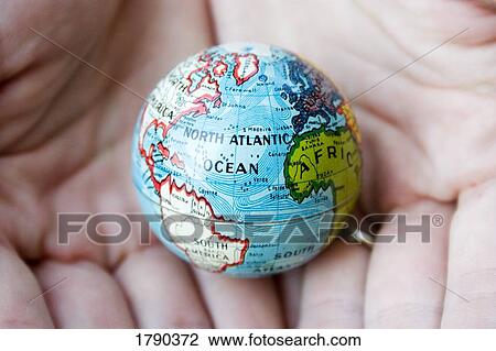 Got the whole world in your hands View Large Photo Image Stock Image - Got the whole world in your hands. Fotosearch