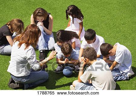 Group prayer View Large Photo Image Stock Photography - Group prayer. Fotosearch