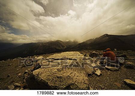 Stock Image - Hiker Taking a Photograph. Fotosearch