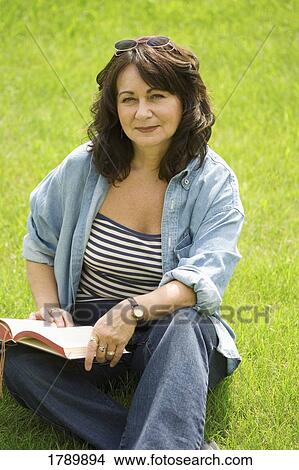 Lady reading in the park View Large Photo Image Picture - Lady reading in the park. Fotosearch