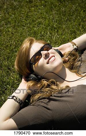 Listening to headphones View Large Photo Image Stock Image - Listening to headphones. Fotosearch
