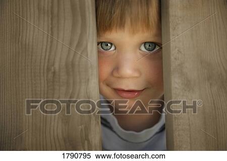 Stock Photography - Little boy peeking. Fotosearch