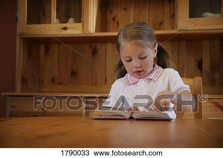 Little girl reading a book View Large Photo Image Stock Image - Little girl reading a book. Fotosearch