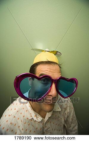 Stock Image - Man in Glasses and Beanie Cap. Fotosearch