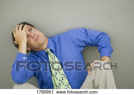 Stock Image - Man pondering. Fotosearch