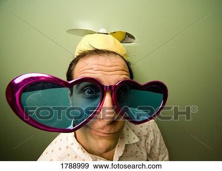 Man wearing funny hat and sunglasses View Large Photo Image Stock Photo - Man wearing funny hat and sunglasses. Fotosearch