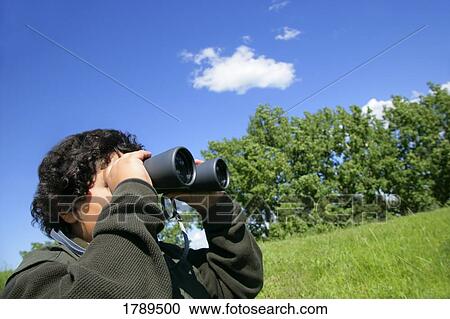 Man with binoculars View Large Photo Image Stock Image - Man with binoculars. Fotosearch