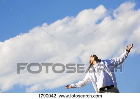 Man worshipping outdoors View Large Photo Image Stock Image - Man worshipping outdoors. Fotosearch