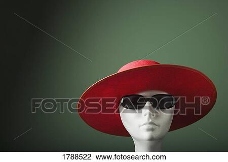 Stock Image - Mannequin in hat and sunglasses. Fotosearch