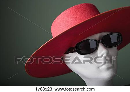 Stock Image - Mannequin in hat and sunglasses. Fotosearch