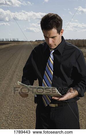 Stock Image - Map looking at a map. Fotosearch