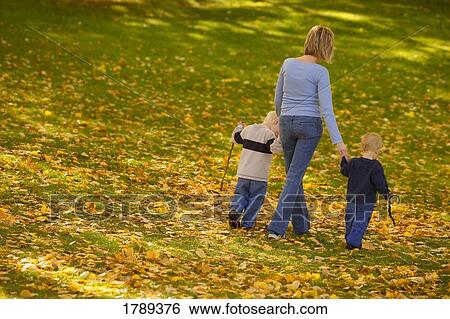 Stock Photograph - Mother and sons. Fotosearch