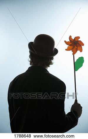 Person holding flower pin wheel View Large Photo Image Stock Photo - Person holding flower pin wheel. Fotosearch