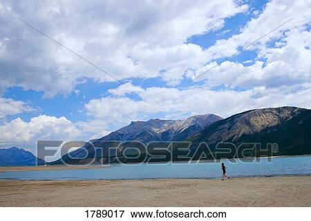 Person running along lake View Large Photo Image Stock Photo - Person running along lake. Fotosearch