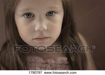 Stock Photo - Portrait of a blue-eyed girl. Fotosearch