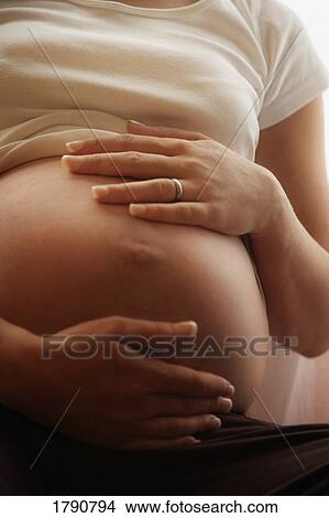 Pregnant woman's belly View Large Photo Image Picture - Pregnant woman's belly. Fotosearch