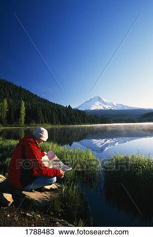 Reading a map by mountain lake View Large Photo Image Stock Image - Reading a map by mountain lake. Fotosearch