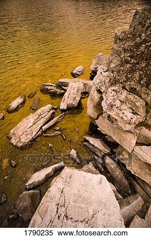 Rocks in water View Large Photo Image Stock Photography - Rocks in water. Fotosearch