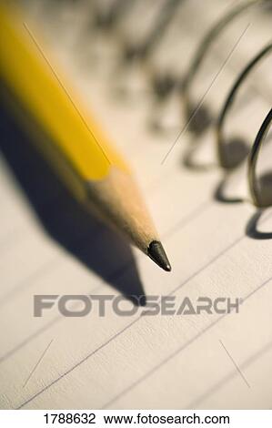 Sharpened pencil on coil notebook View Large Photo Image Stock Image - Sharpened pencil on coil notebook. Fotosearch