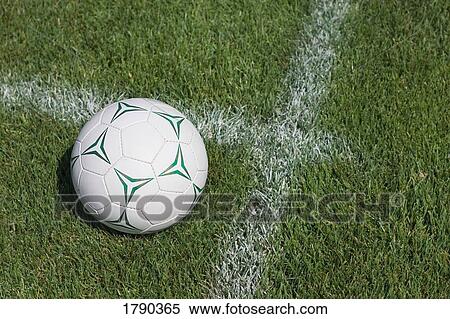 Stock Photography - Soccer ball on grass. Fotosearch