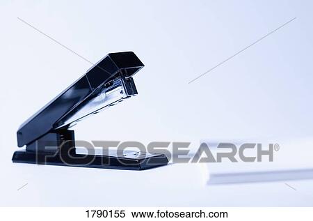 Stock Photography - Stapler and paper. Fotosearch