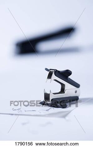Stapler remover with looming stapler in behind View Large Photo Image Stock Photograph - Stapler remover with looming stapler in behind. Fotosearch