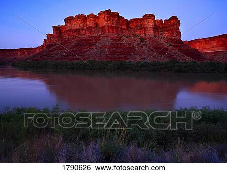 Sunset over red cliffs View Large Photo Image Stock Photograph - Sunset over red cliffs. Fotosearch
