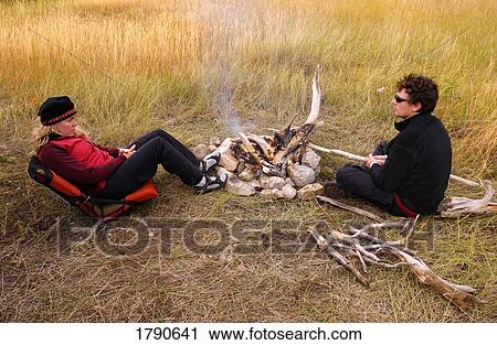 Taking a break in camp View Large Photo Image Stock Image - Taking a break in camp. Fotosearch