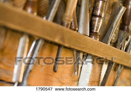 Tools hanging on a shelf View Large Photo Image Stock Photo - Tools hanging on a shelf. Fotosearch