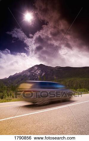 Vehicle on a scenic highway View Large Photo Image Stock Photograph - Vehicle on a scenic highway. Fotosearch