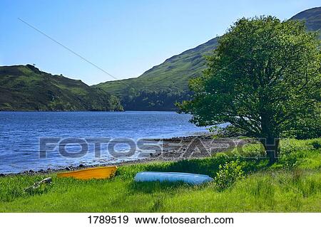 Stock Photo - Waterside and distant hills. Fotosearch