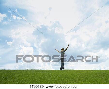Stock Photo - Woman in field. Fotosearch