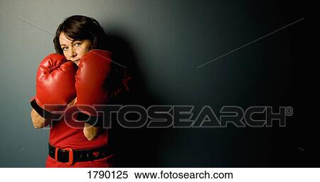 Woman with boxing gloves View Large Photo Image Stock Photography - Woman with boxing gloves. Fotosearch