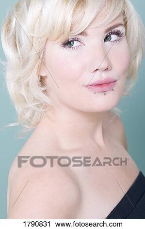 Woman with lip piercings View Large Photo Image Stock Image - Woman with lip piercings. Fotosearch