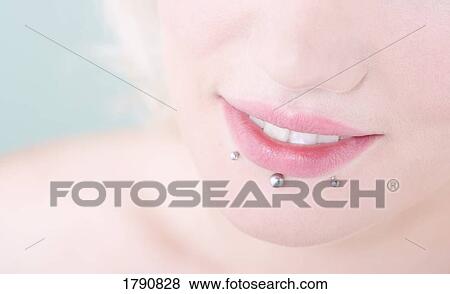 Woman with lip piercings View Large Photo Image Stock Photo - Woman with lip piercings. Fotosearch