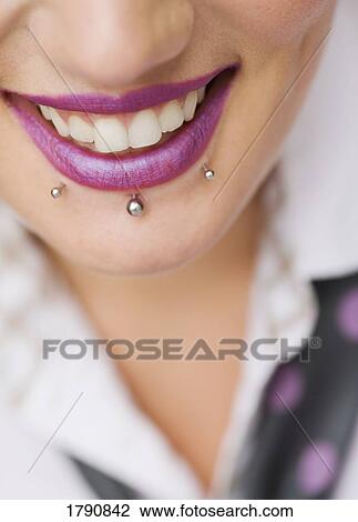 Stock Image - Woman with pierced lip. Fotosearch