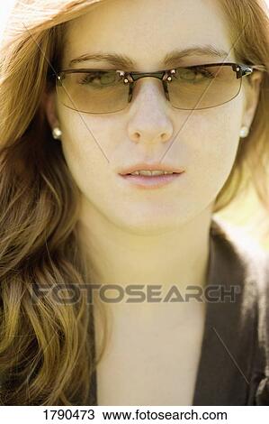 Stock Image - Woman with sunglasses. Fotosearch