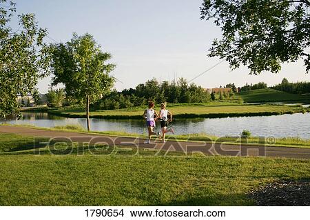 Women jogging in park View Large Photo Image Picture - Women jogging in park. Fotosearch