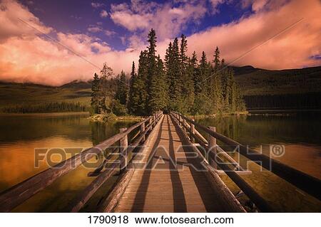 Wooden foot bridge to island View Large Photo Image Stock Photo - Wooden foot bridge to island. Fotosearch
