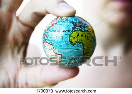 Stock Image - World at your finger tips. Fotosearch