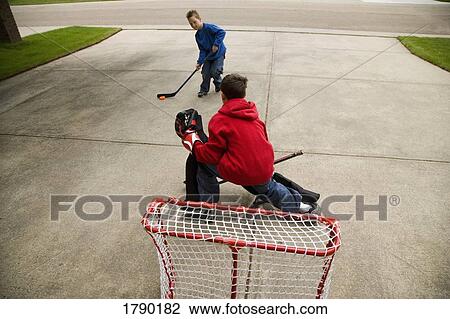 Young goalie anticipating a shot on net View Large Photo Image Stock Image - Young goalie anticipating a shot on net. Fotosearch