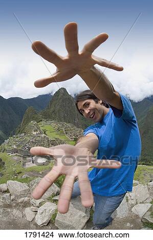 A man at the ancient Inca ruins of Machu Picchu, Peru View Large Photo Image Picture - A man at the ancient Inca ruins of Machu Picchu, Peru. Fotosearch