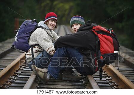 Stock Photo - A young couple hiking . Fotosearch