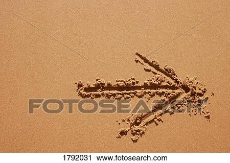 Arrow drawn in the sand View Large Photo Image Stock Image - Arrow drawn in the sand. Fotosearch