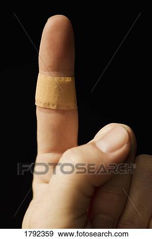 Bandage on finger View Large Photo Image Stock Photo - Bandage on finger. Fotosearch