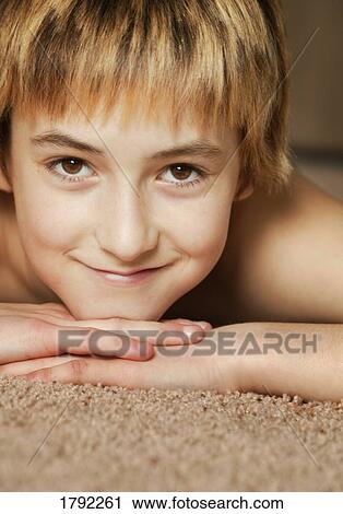 Boy laying down View Large Photo Image Stock Image - Boy laying down. Fotosearch