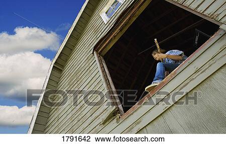 Boy playing guitar in barn window View Large Photo Image Stock Image - Boy playing guitar in barn window. Fotosearch