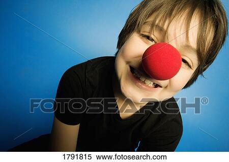 Boy wearing a clown nose View Large Photo Image Stock Photography - Boy wearing a clown nose. Fotosearch